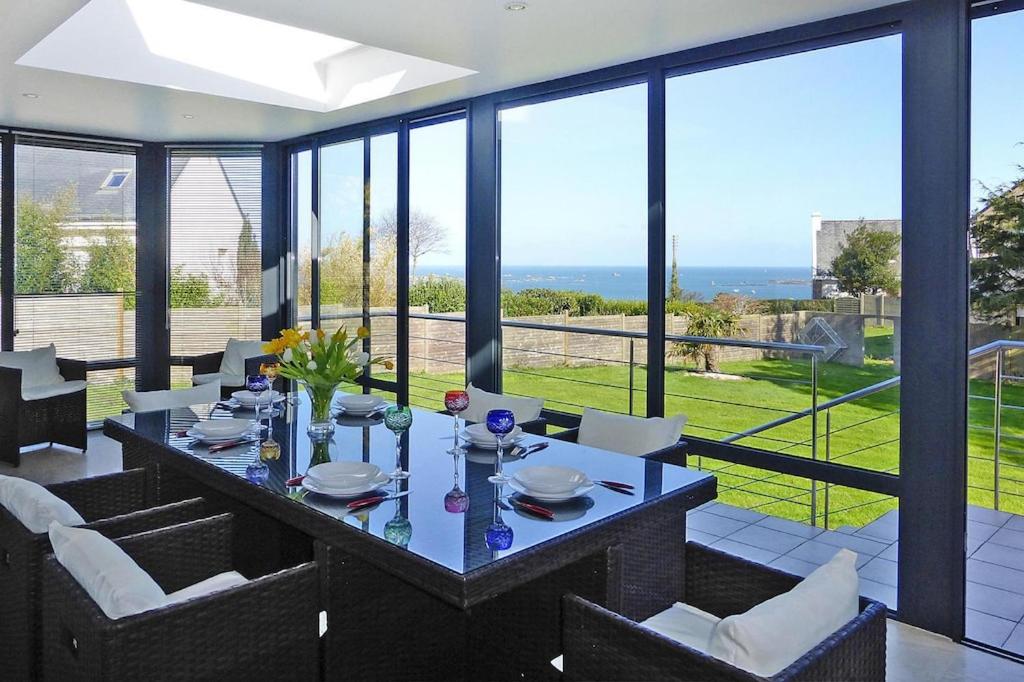 a dining room with a table and chairs at Cottage, Ploubazlanec in Ploubazlanec