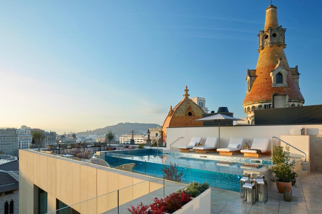 a swimming pool on the roof of a building at ME Barcelona in Barcelona