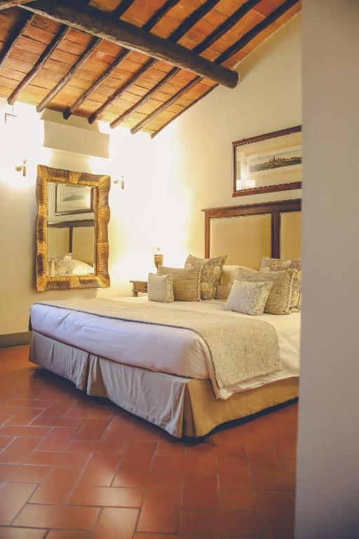 Posteľ alebo postele v izbe v ubytovaní Capannelle Wine Resort