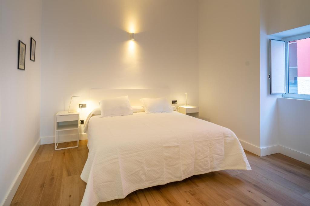 Postel nebo postele na pokoji v ubytování Albor Suites