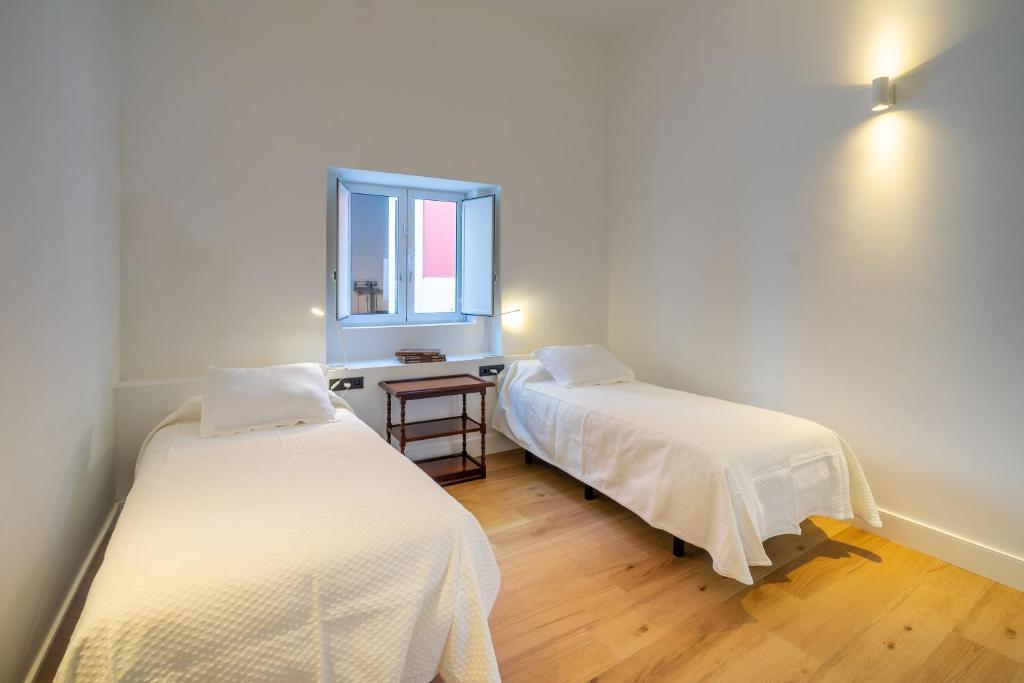 Postel nebo postele na pokoji v ubytování Albor Suites