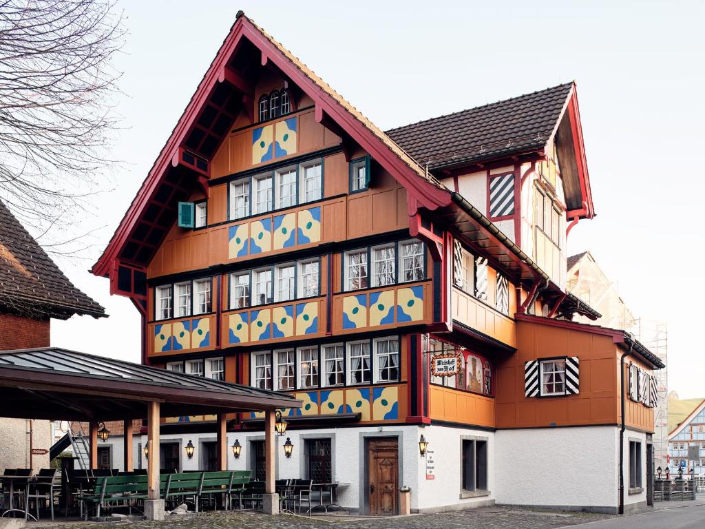 a large building with a lot of windows at Gasthaus Hof in Appenzell