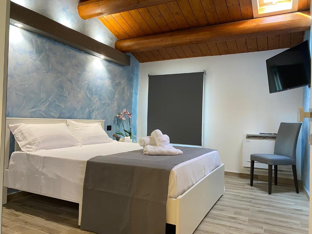 מיטה או מיטות בחדר ב-Antica Locanda Zio Cesare