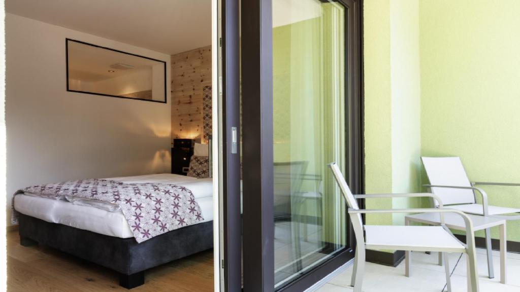 Postel nebo postele na pokoji v ubytování Cityhotel Goldener Adler B&B