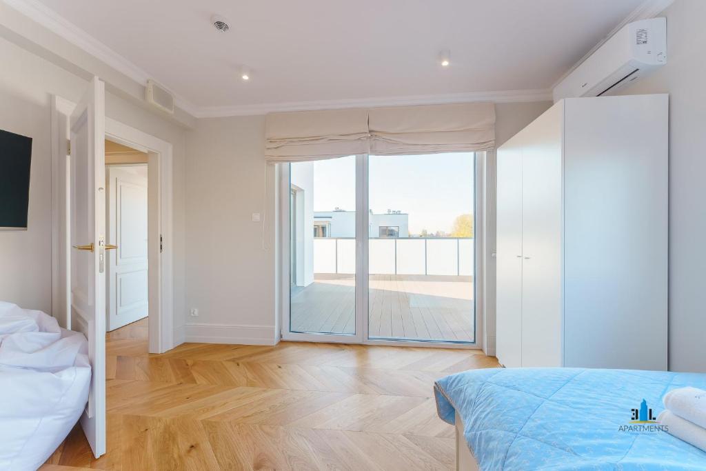 Televízia a/alebo spoločenská miestnosť v ubytovaní 3L Apartments Kasprowicza VIP