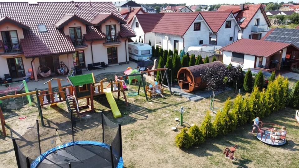an aerial view of a backyard with a playground at Villa Marcus in Rowy