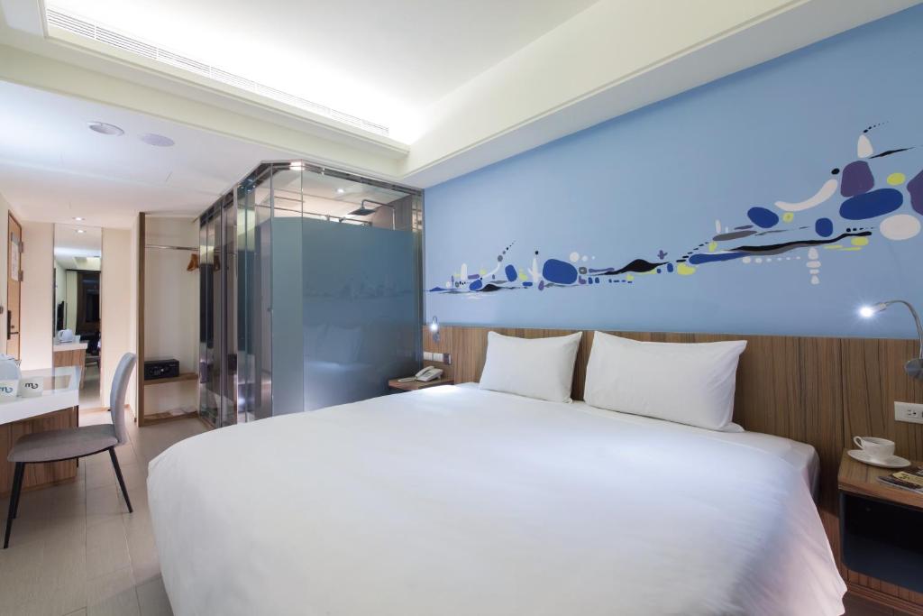 Voodi või voodid majutusasutuse Hotel MU toas