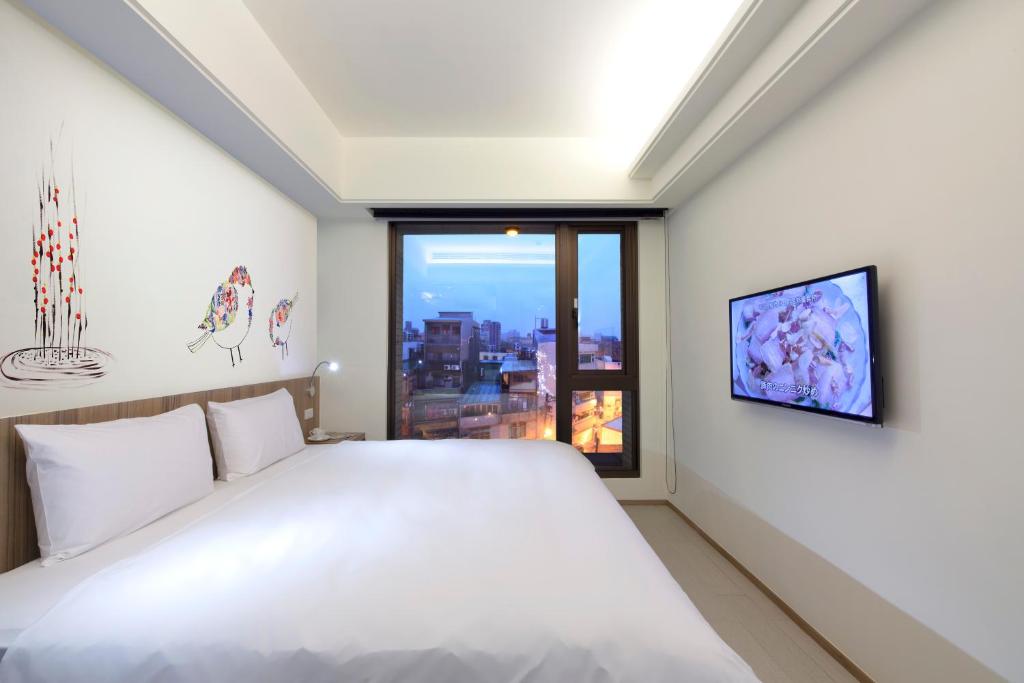 Voodi või voodid majutusasutuse Hotel MU toas