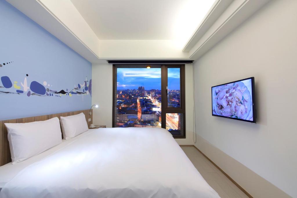 Voodi või voodid majutusasutuse Hotel MU toas