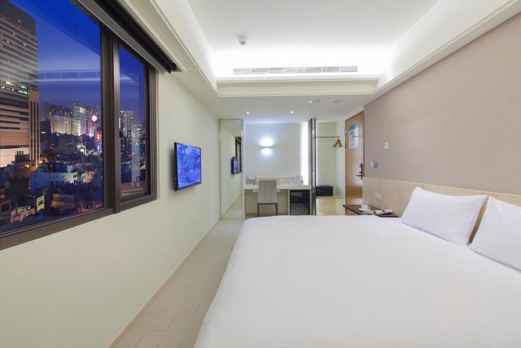 Voodi või voodid majutusasutuse Hotel MU toas