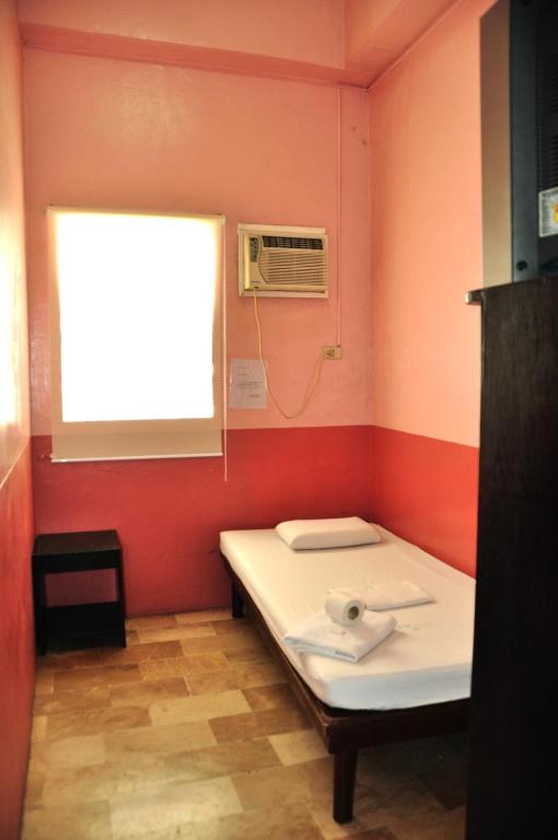 Postel nebo postele na pokoji v ubytování GV Hotel - Lapu-Lapu City