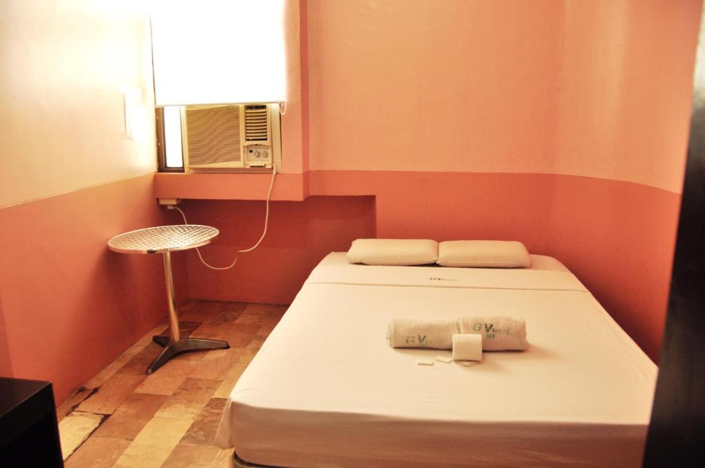Postel nebo postele na pokoji v ubytování GV Hotel - Lapu-Lapu City