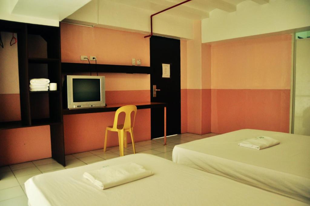 Postel nebo postele na pokoji v ubytování GV Hotel - Lapu-Lapu City