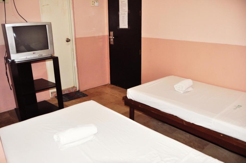 Postel nebo postele na pokoji v ubytování GV Hotel - Lapu-Lapu City
