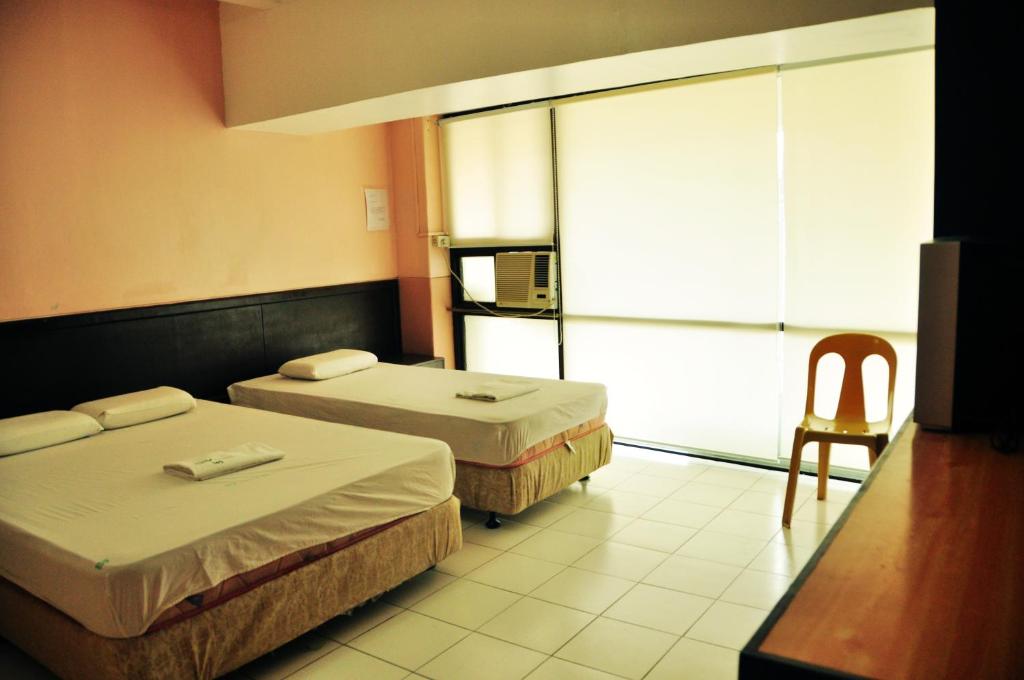 Postel nebo postele na pokoji v ubytování GV Hotel - Lapu-Lapu City