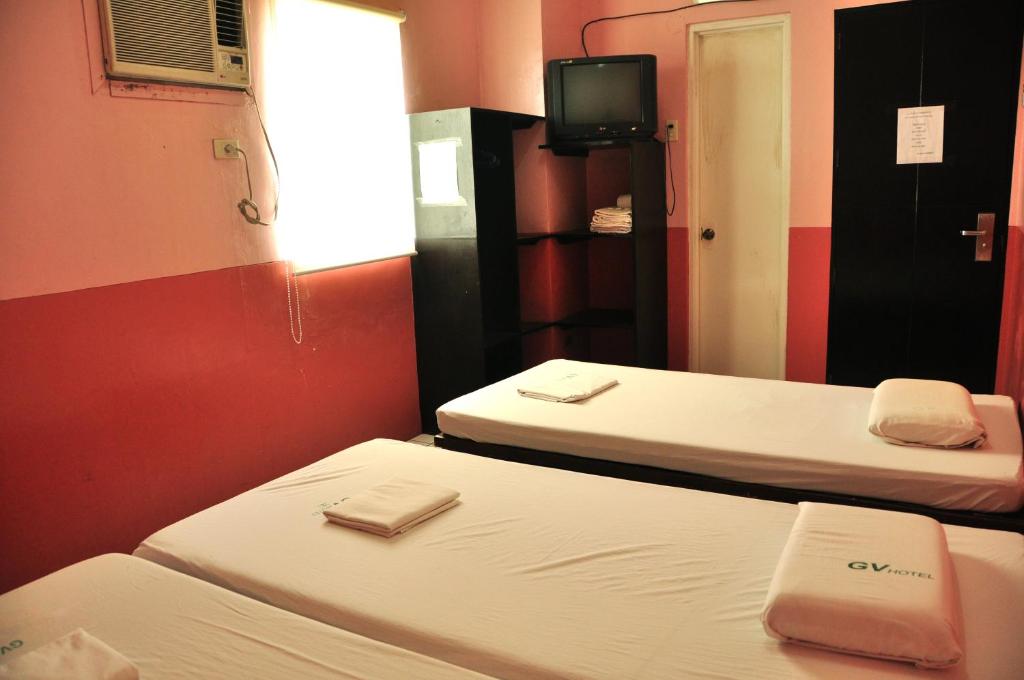 Postel nebo postele na pokoji v ubytování GV Hotel - Lapu-Lapu City