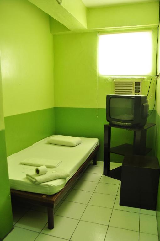 Postel nebo postele na pokoji v ubytování GV Hotel - Lapu-Lapu City