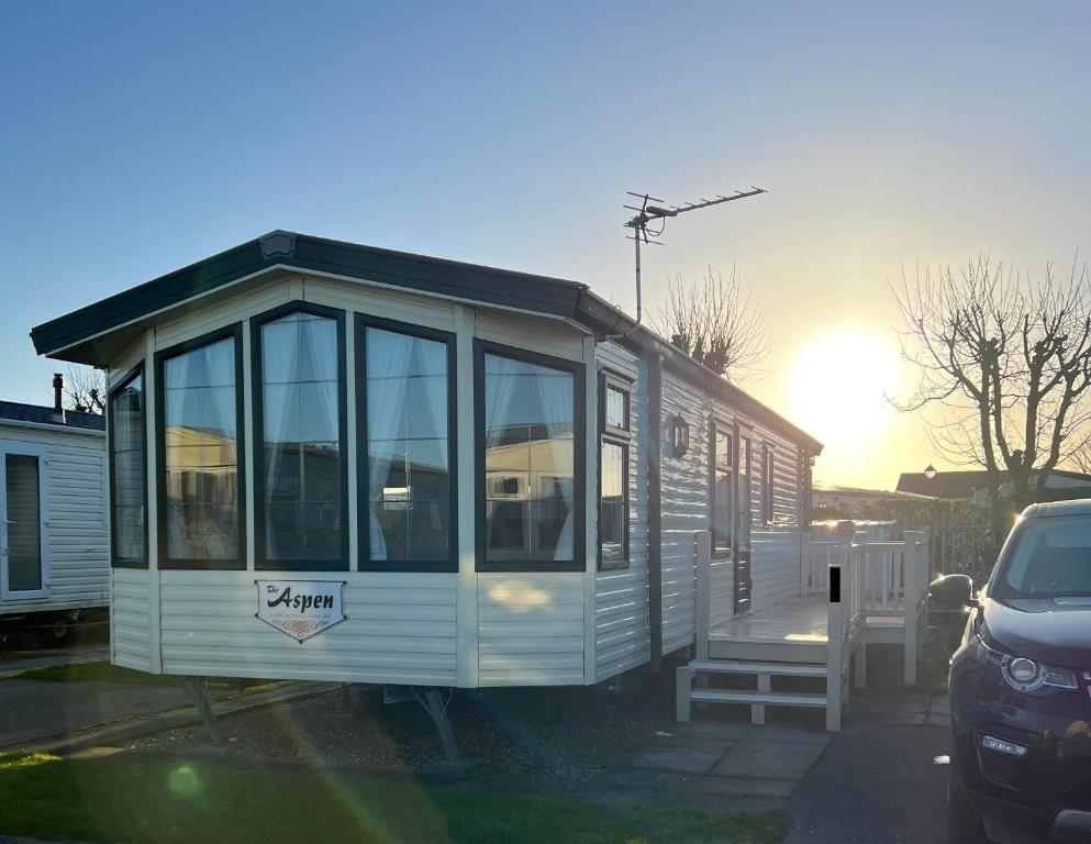 a tiny house is parked in a parking lot at Jade's Haven - Pet friendly, Ingoldmells in Ingoldmells