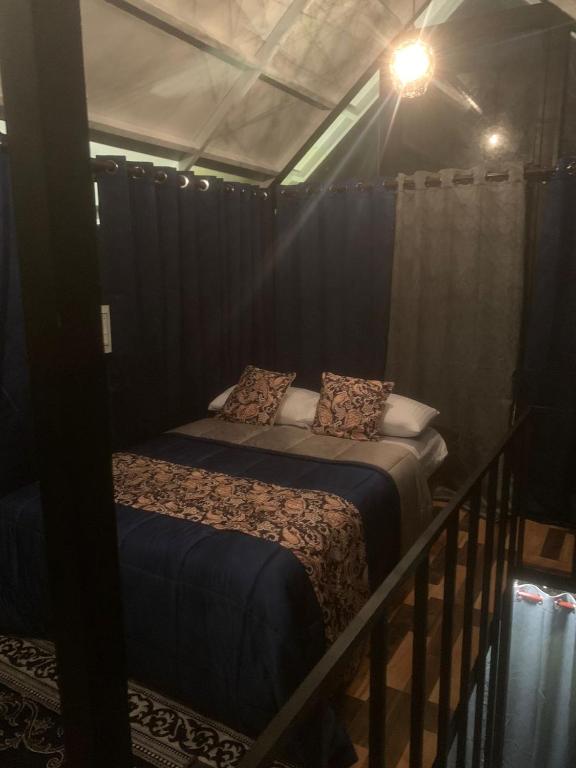 Postel nebo postele na pokoji v ubytování Chalets Resort Masinagudi