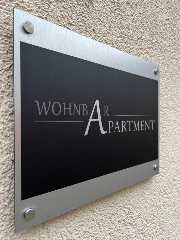 a sign on the side of a building with the words wound a department at wohnbar-Apartment in Worbis