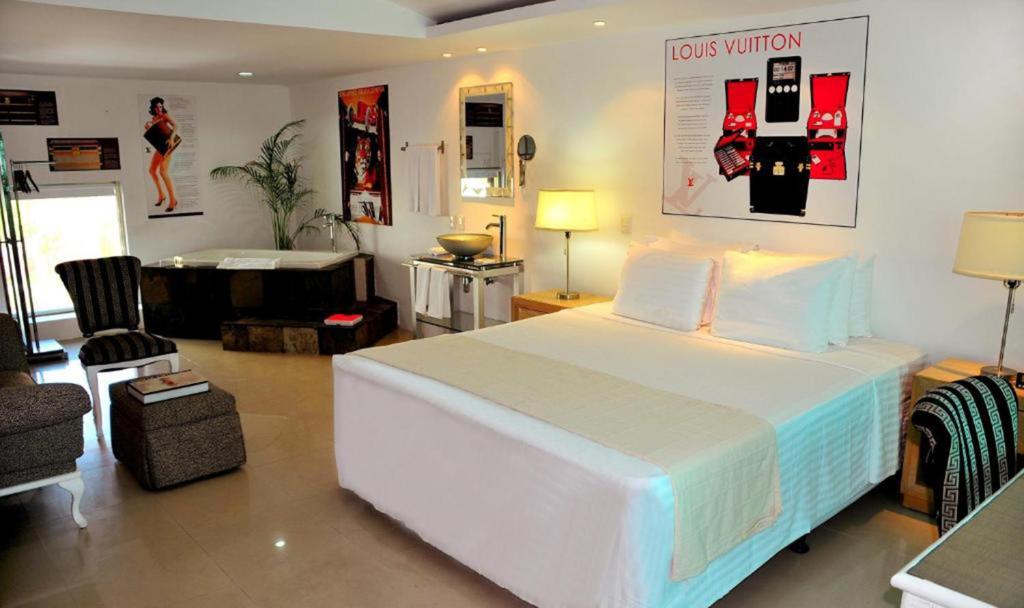 Postel nebo postele na pokoji v ubytování MayaFair Design Hotel