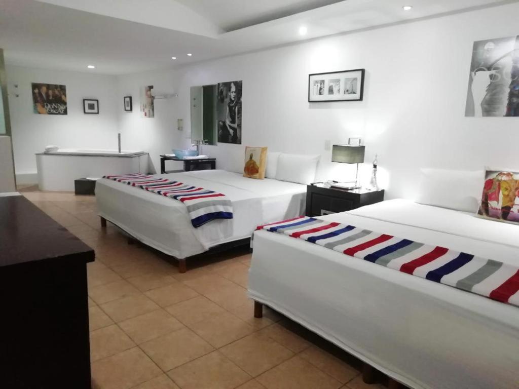 Postel nebo postele na pokoji v ubytování MayaFair Design Hotel