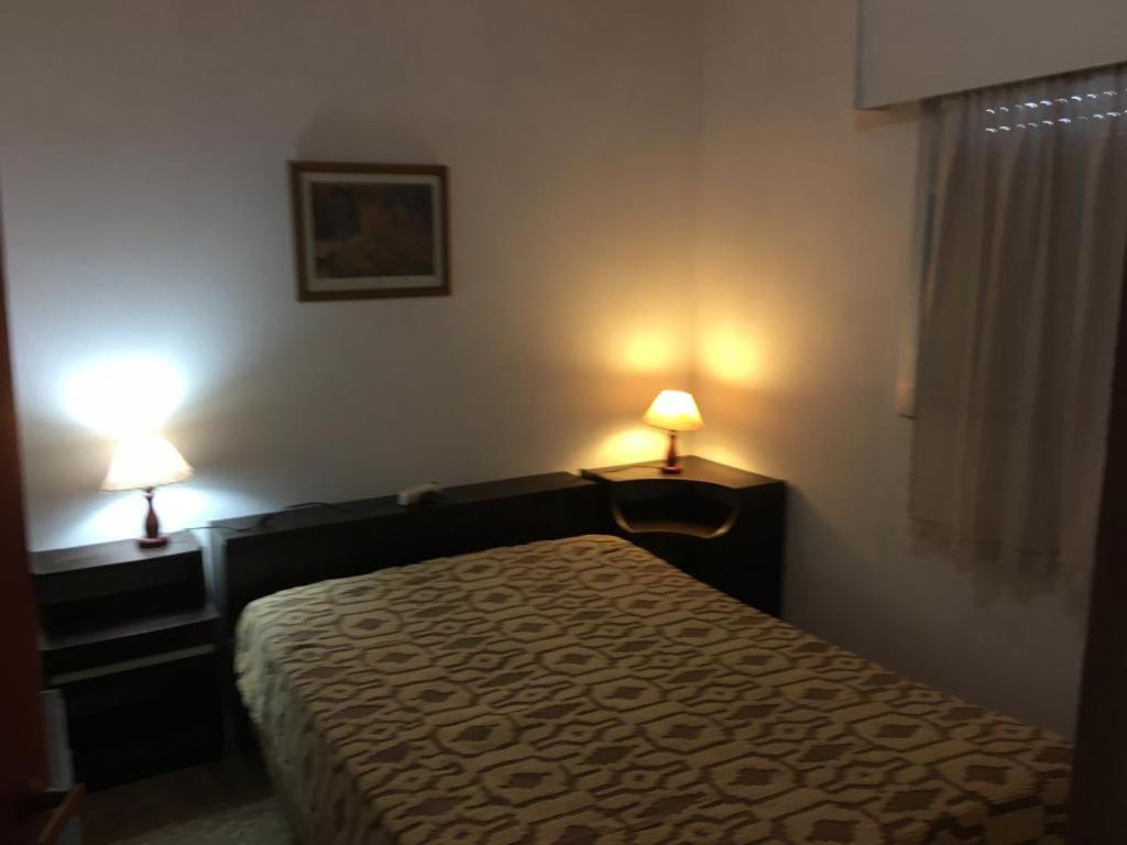 Voodi või voodid majutusasutuse Amplia casa con fondo y estacionamiento a metros del mar toas