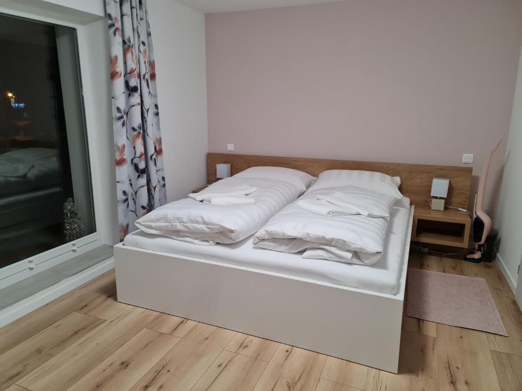 Postel nebo postele na pokoji v ubytování Apartmány EMA a PETER
