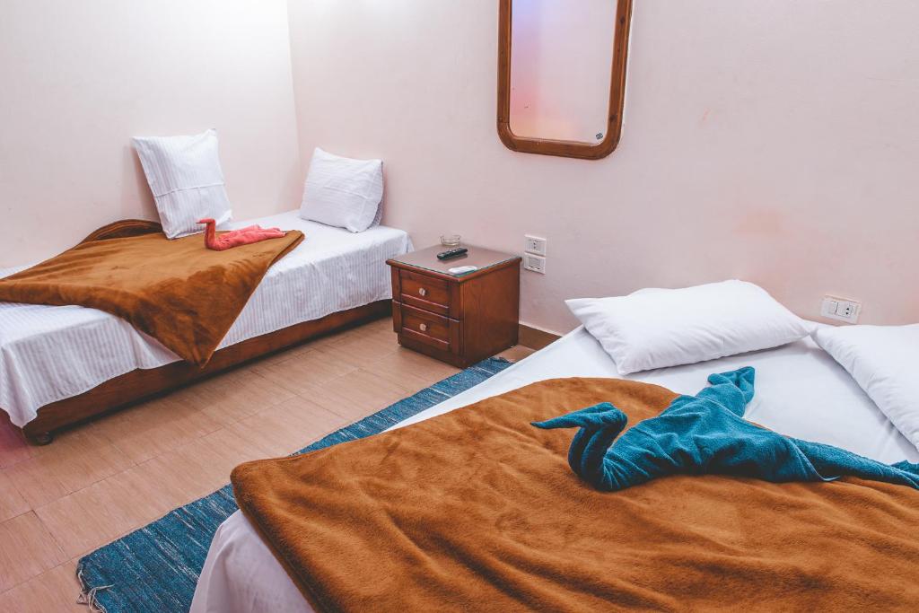 Postel nebo postele na pokoji v ubytování Gina Motel Dahab