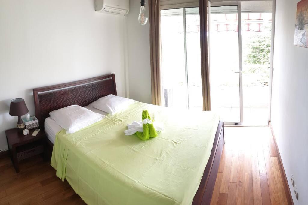Postel nebo postele na pokoji v ubytování Le Lis Vacances et Affaire Cosy vue Mer