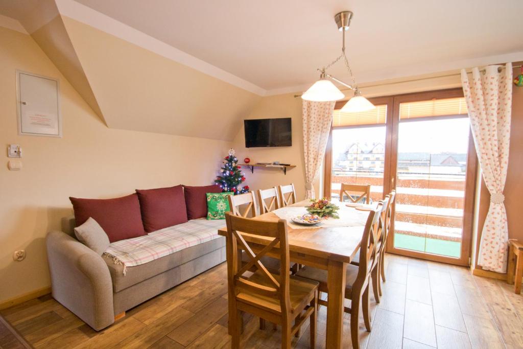 Posedenie v ubytovaní Apartamenty Trojaki przy Termach - Bańska Niżna