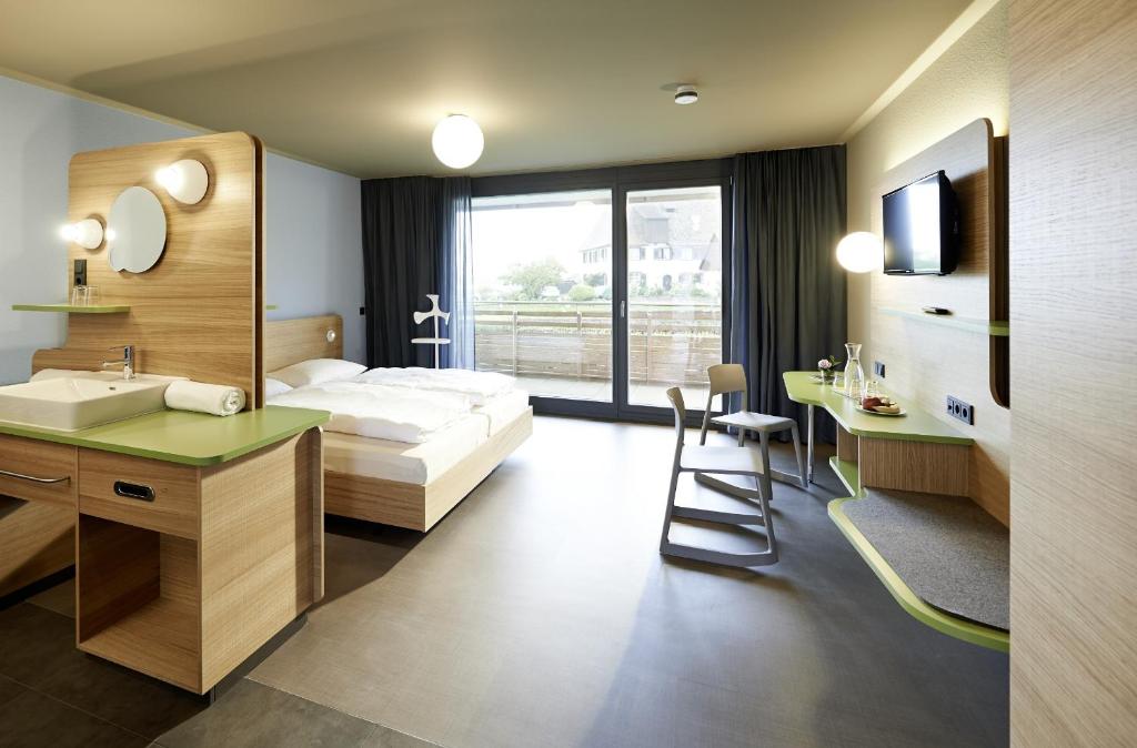 Postel nebo postele na pokoji v ubytování Hotel mein inselglück