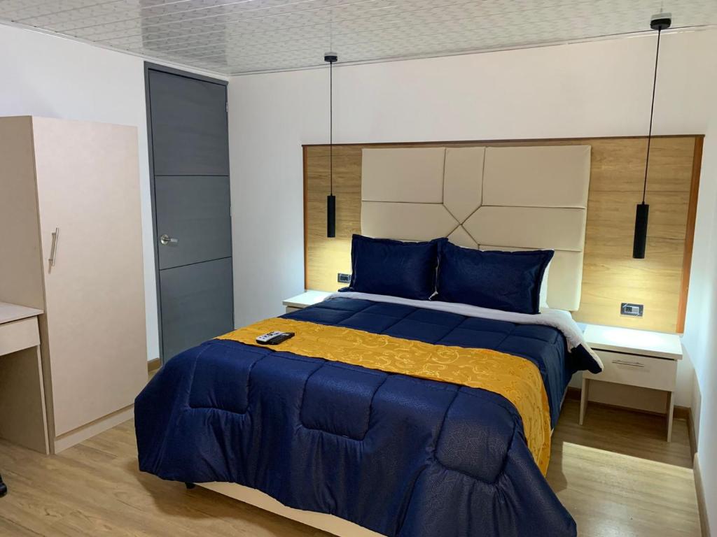 Postel nebo postele na pokoji v ubytování Hotel Casa Modelia