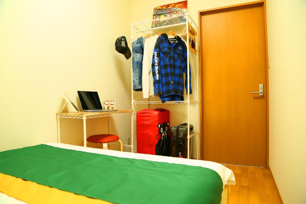 Postel nebo postele na pokoji v ubytování E JOY INN-West Shinjuku Branch