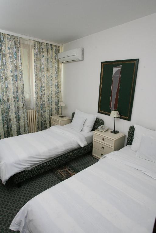 Postel nebo postele na pokoji v ubytování Hotel Radmilovac