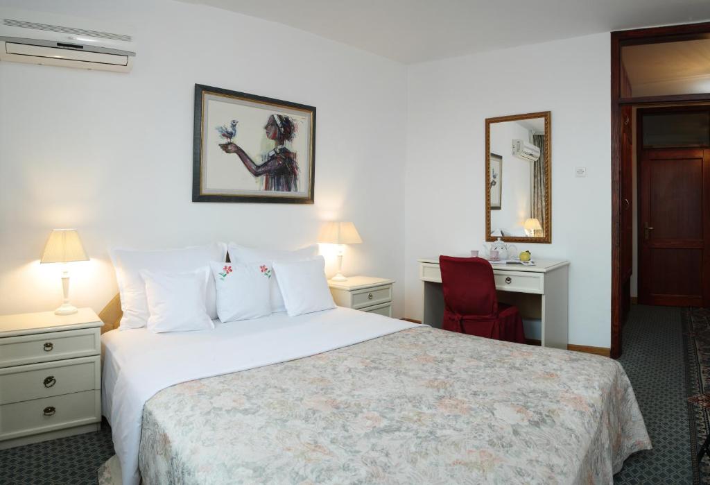 Postel nebo postele na pokoji v ubytování Hotel Radmilovac