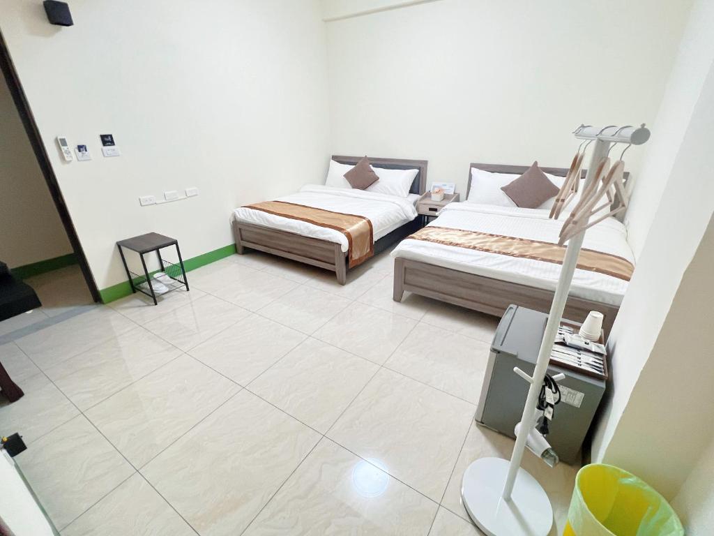 Postel nebo postele na pokoji v ubytování Mu Travel B&B