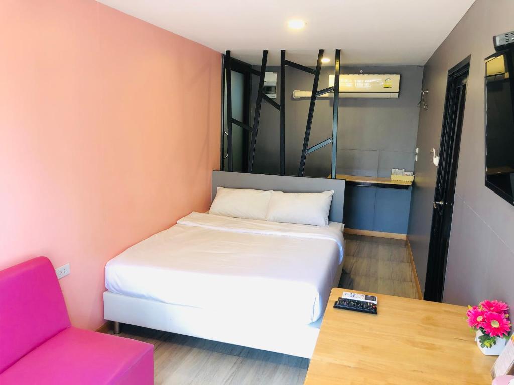 Postel nebo postele na pokoji v ubytování Inn Box ChA-AM