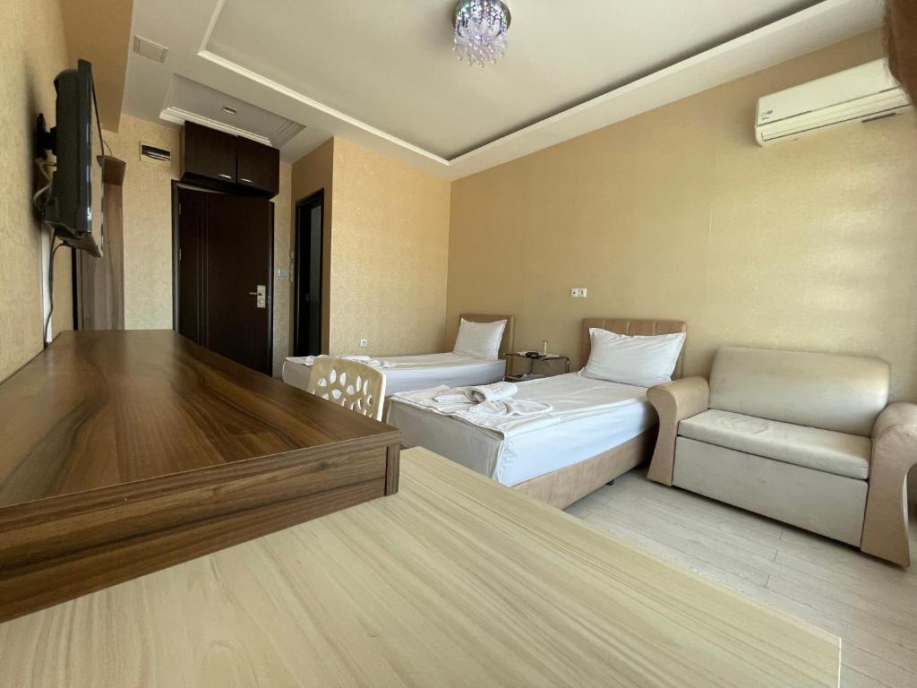 Postel nebo postele na pokoji v ubytování Hotel Dunav