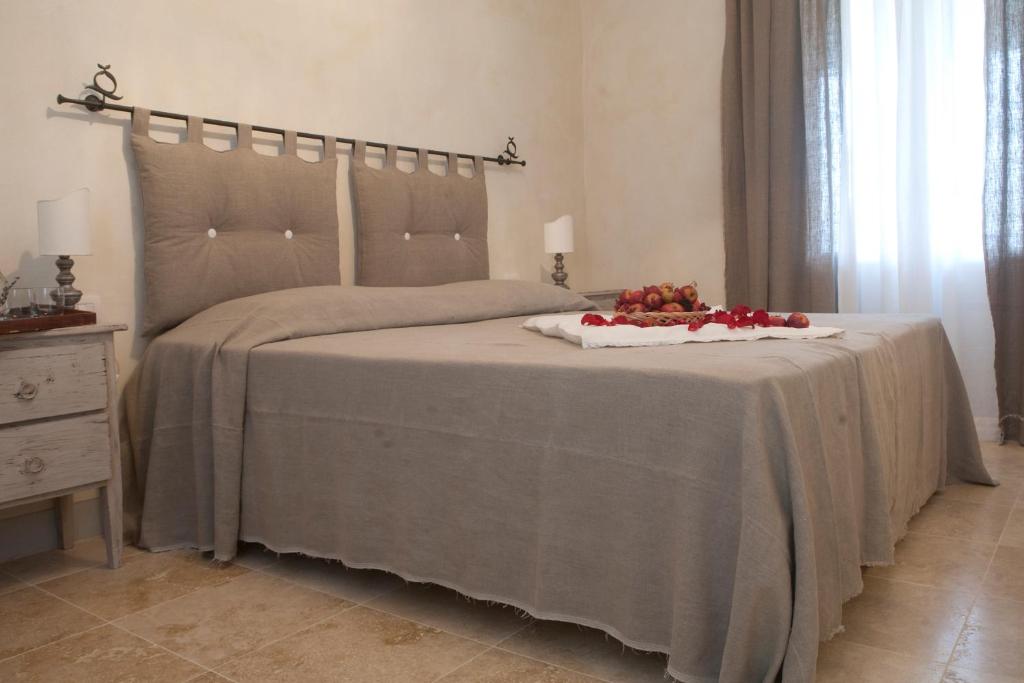 Ένα ή περισσότερα κρεβάτια σε δωμάτιο στο Rinidia - Siena Celso Cittadini Grande