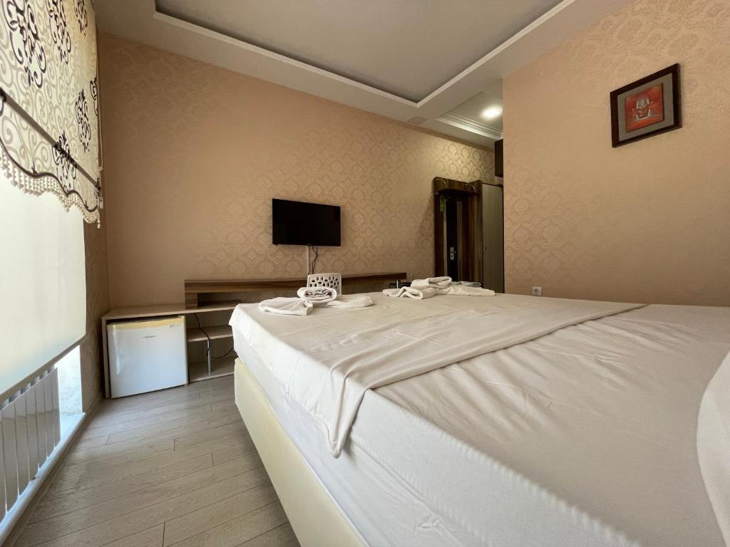 Postel nebo postele na pokoji v ubytování Hotel Dunav