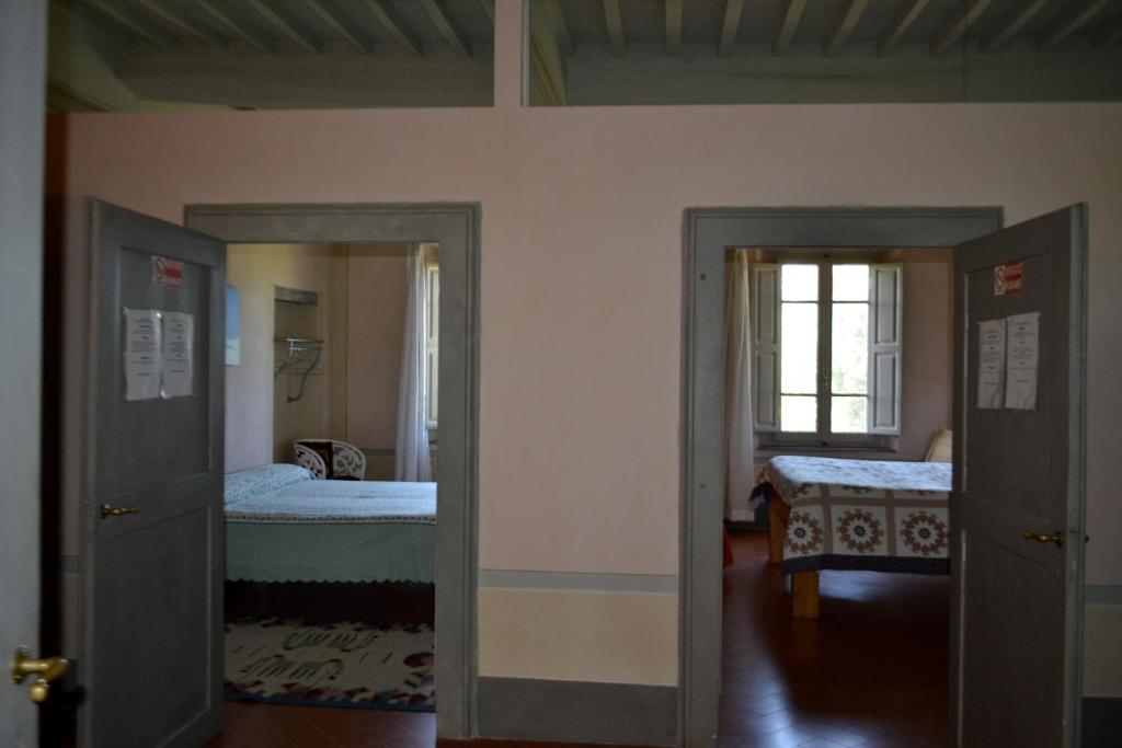 Postel nebo postele na pokoji v ubytování B&B Glicine e Luna
