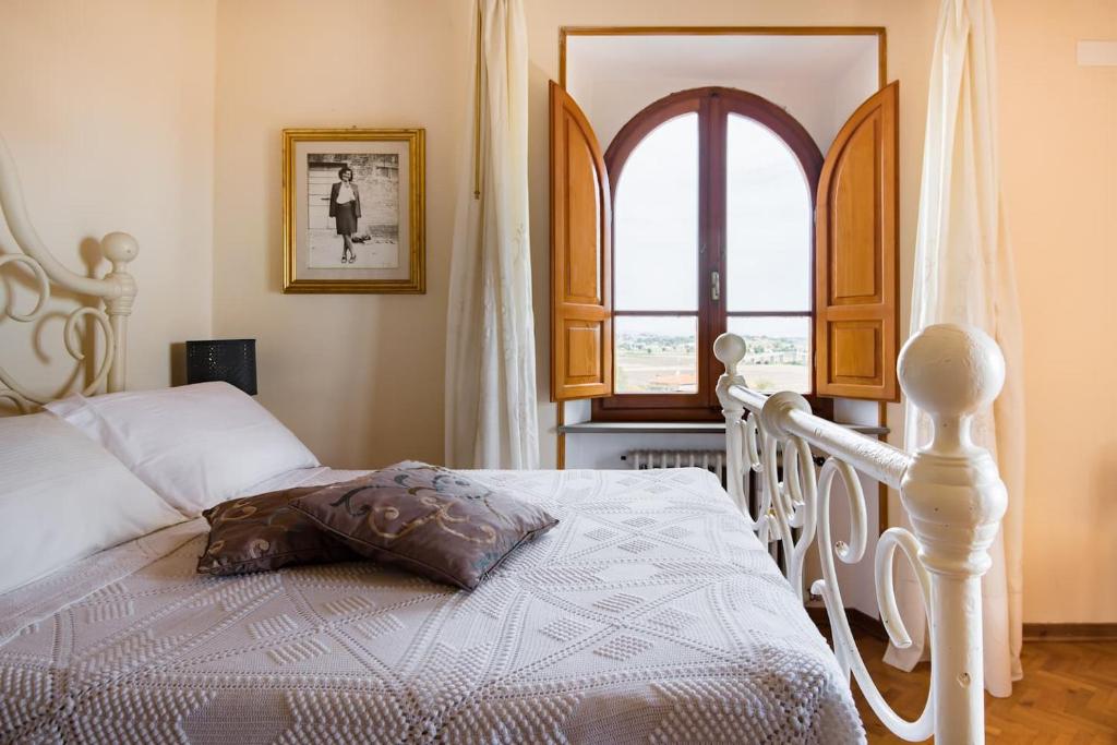 Postel nebo postele na pokoji v ubytování Villa Eleonora