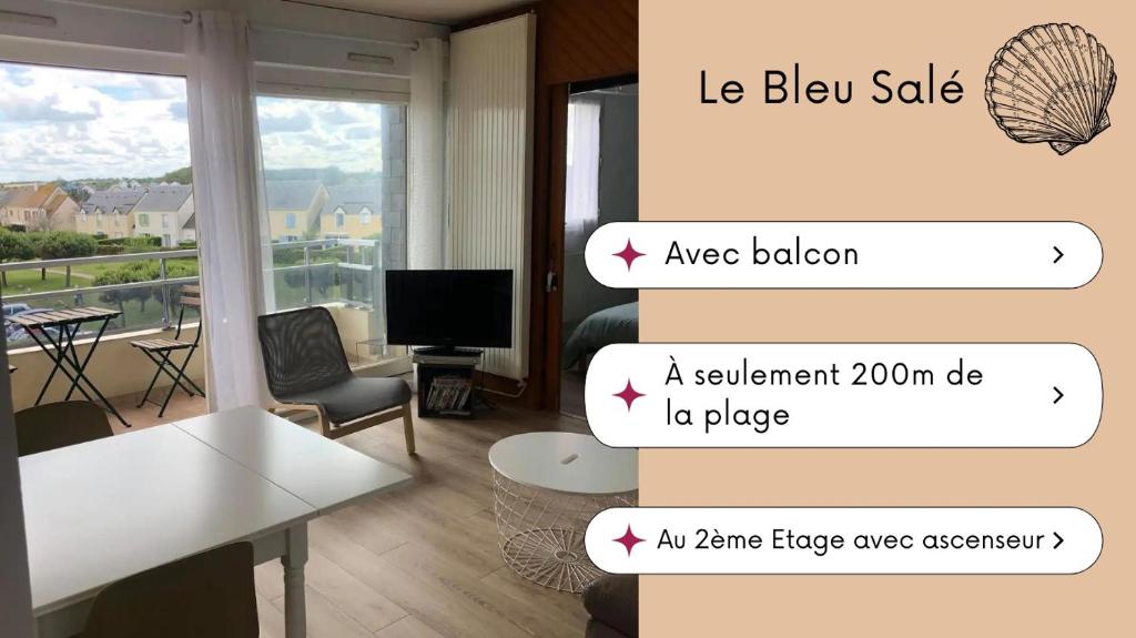a living room with a white table and a window at Bleu Salé - F2 Courseulles avec balcon in Courseulles-sur-Mer