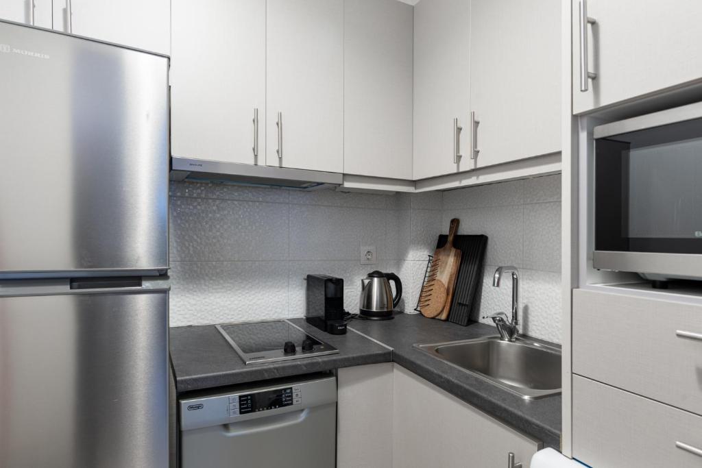 Kuchyňa alebo kuchynka v ubytovaní Syntagma Spotlight Residence