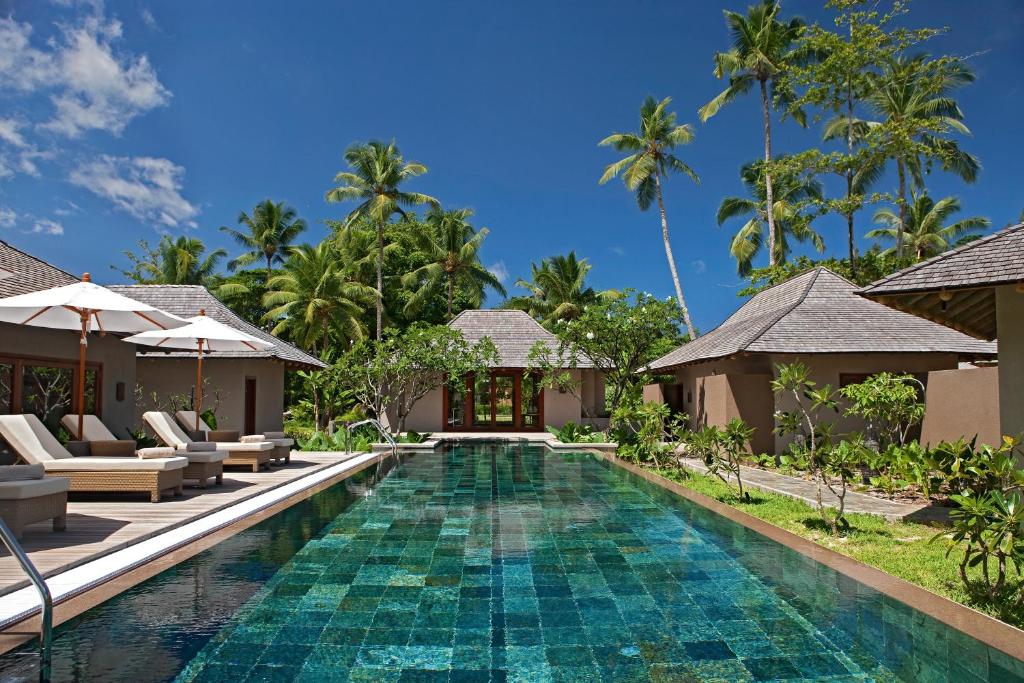 an image of a swimming pool at a resort at Constance Ephelia in Port Glaud