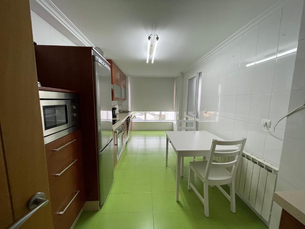 Kuchyň nebo kuchyňský kout v ubytování OKTHEWAY Castelao Street