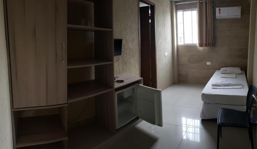 Cama ou camas em um quarto em Hotel Uzi Praia