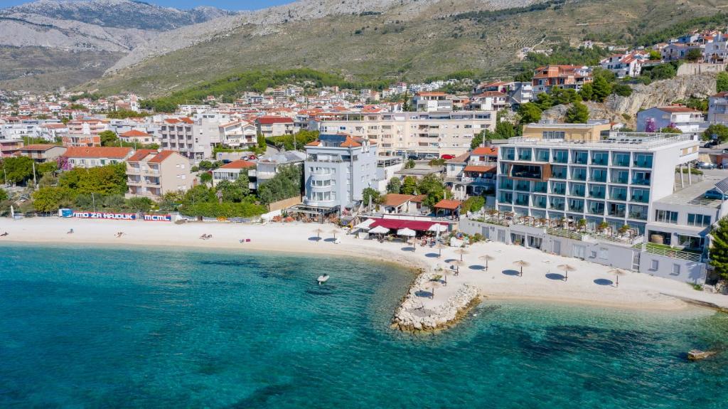an aerial view of a beach in a resort at Sunset Split Rooms in Podstrana
