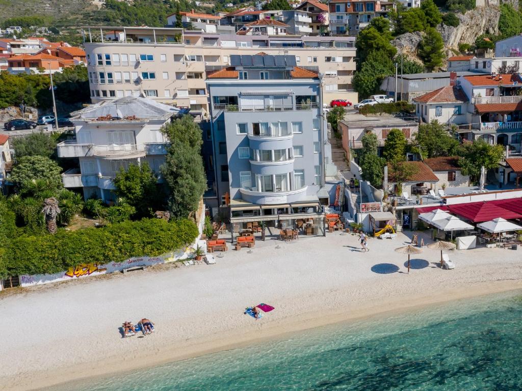 an aerial view of a beach with buildings at Sunset Split Rooms in Podstrana